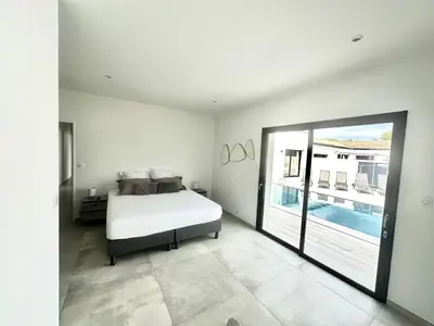 Un ou plusieurs lits dans un hébergement de l'établissement MAISON CONTEMPORAINE proche Chatelaillon plage