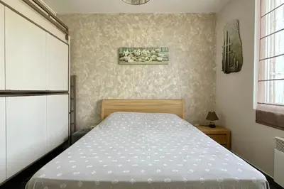Un ou plusieurs lits dans un hébergement de l'établissement Appartement avec terrasse