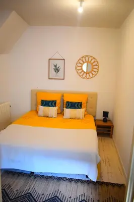 Un ou plusieurs lits dans un hébergement de l'établissement Logement cozy proche du centre-ville