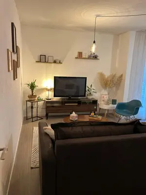 Télévision ou salle de divertissement dans l'établissement Niort Home