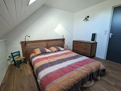 Un ou plusieurs lits dans un hébergement de l'établissement La maison de Joe