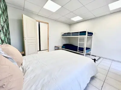 Un ou plusieurs lits dans un hébergement de l'établissement Le Grand Penon ~ Logement Spacieux à 6 min du Parc