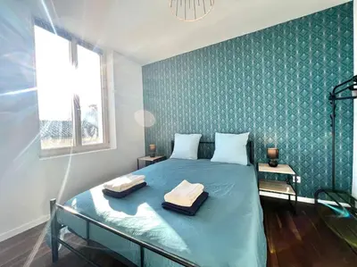 Un ou plusieurs lits dans un hébergement de l'établissement La Ribaudière Maison de ville à 5 min Futuroscope