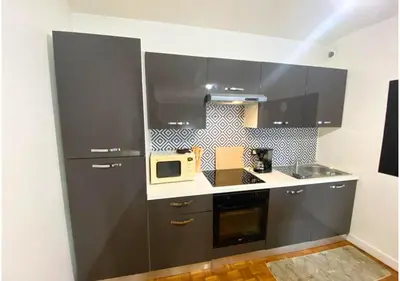 Cuisine ou kitchenette dans l'établissement Le 107 - Poitiers - CHU - La Conciergerie.