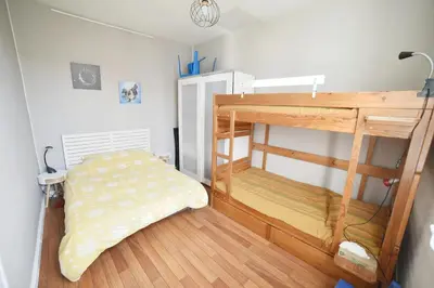 Un ou plusieurs lits dans un hébergement de l'établissement Charmante maisonnette avec terrasse