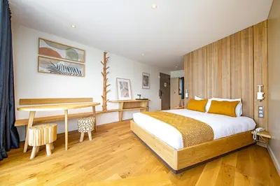 Un ou plusieurs lits dans un hébergement de l'établissement Hôtel Ecolodgee
