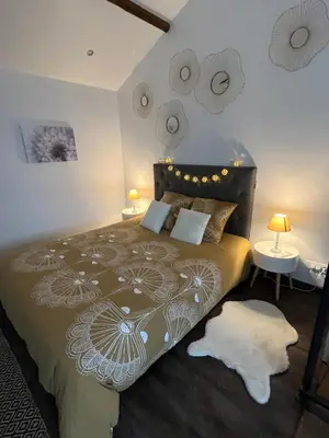 Un ou plusieurs lits dans un hébergement de l'établissement La Petite Maison - La Grange des Colporteurs