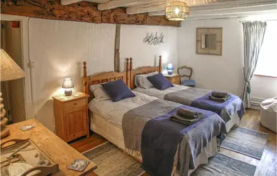 Un ou plusieurs lits dans un hébergement de l'établissement Amazing Home In Suaux