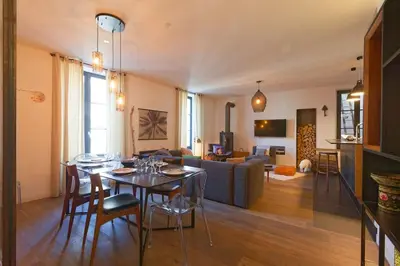 Coin salon dans l'établissement L'Olympe - triplex avec spa et rooftop Classé 4*