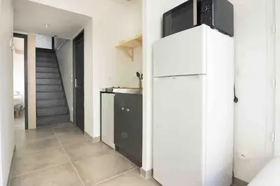 Cuisine ou kitchenette dans l'établissement La Petite Croisée - extérieur et plage