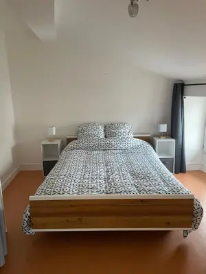 Un ou plusieurs lits dans un hébergement de l'établissement Logement familial 3 chambres 2 wc 2 sdb Futuroscope Arena Aquascope Palais des Congrès