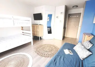 Un ou plusieurs lits dans un hébergement de l'établissement Appartement au cœur du Futuroscope