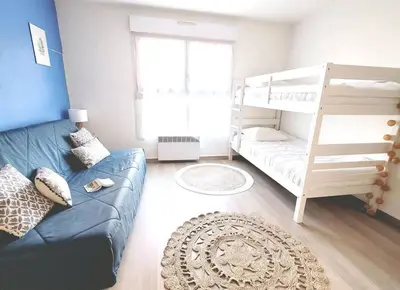 Un ou plusieurs lits dans un hébergement de l'établissement Appartement au cœur du Futuroscope