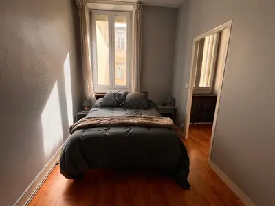 Un ou plusieurs lits dans un hébergement de l'établissement La Colbertine - Charming Apartment in Place Colbert