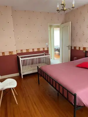 Un ou plusieurs lits dans un hébergement de l'établissement Agréable maison