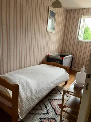 Un ou plusieurs lits dans un hébergement de l'établissement Agréable maison