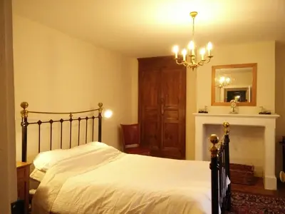 Un ou plusieurs lits dans un hébergement de l'établissement La Maison Bleue