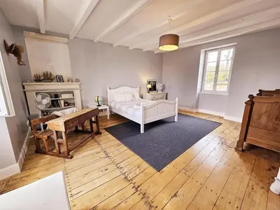 Un ou plusieurs lits dans un hébergement de l'établissement La spacieuse maison des miots