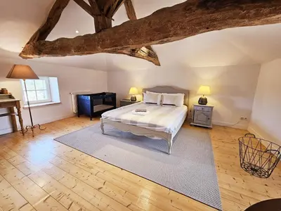 Un ou plusieurs lits dans un hébergement de l'établissement La spacieuse maison des miots
