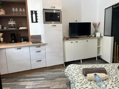 Cuisine ou kitchenette dans l'établissement Cocooning à cognac