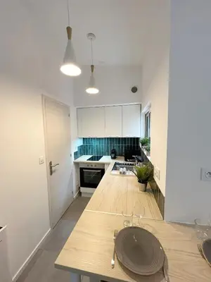 Cuisine ou kitchenette dans l'établissement T1Bis centre ville avec Patio