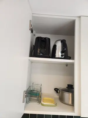 Cuisine ou kitchenette dans l'établissement T1Bis centre ville avec Patio