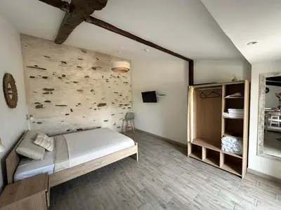 Un ou plusieurs lits dans un hébergement de l'établissement Chambres d'Hôtes ''SOUS L'OMBRE DES MIMOSAS''