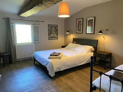 Un ou plusieurs lits dans un hébergement de l'établissement La Maison des Coteaux