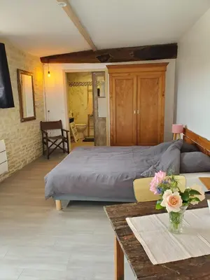 Un ou plusieurs lits dans un hébergement de l'établissement Damvix Chambre d hôtes La Barbée