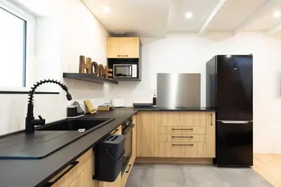 Cuisine ou kitchenette dans l'établissement Grand T2 cosy proche Futuroscope
