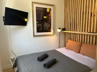 Un ou plusieurs lits dans un hébergement de l'établissement Appartement Bird II proche centre gare, parking
