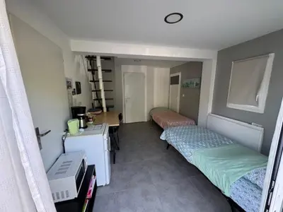 Un ou plusieurs lits dans un hébergement de l'établissement Chambre à la campagne