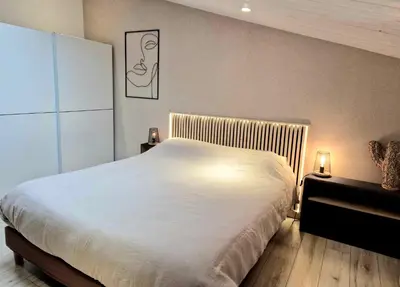 Un ou plusieurs lits dans un hébergement de l'établissement Maisonnette cosy proche de La Rochelle et de L'Ile de Ré