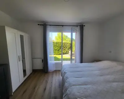Un ou plusieurs lits dans un hébergement de l'établissement Charmante maison de vacances - Domaine les Forges