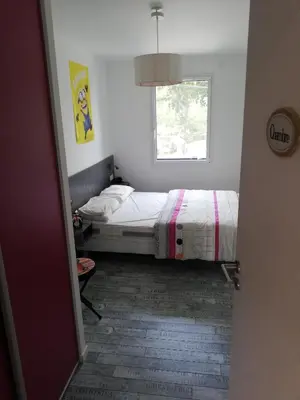 Un ou plusieurs lits dans un hébergement de l'établissement coin de paradis 3 chambres