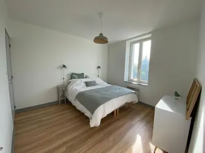 Un ou plusieurs lits dans un hébergement de l'établissement Appartement T4 et Parking à 3km du Futuroscope