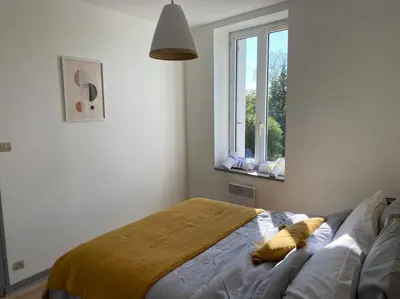 Un ou plusieurs lits dans un hébergement de l'établissement Appartement T4 et Parking à 3km du Futuroscope