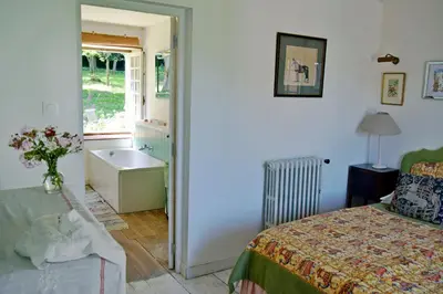 Un ou plusieurs lits dans un hébergement de l'établissement Gite Du Jardin
