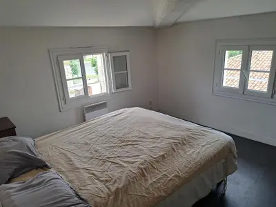 Un ou plusieurs lits dans un hébergement de l'établissement Duplex vue dégagée sur le vieux Saintes