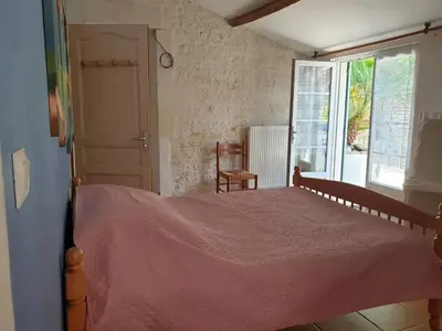 Un ou plusieurs lits dans un hébergement de l'établissement Maison accueillante avec piscine à Meursac + Spa