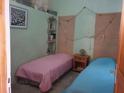 Un ou plusieurs lits dans un hébergement de l'établissement Maison de charme à Meursac avec piscine