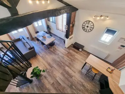 Coin salon dans l'établissement Duplex Le Chai de l'Abreuvoir