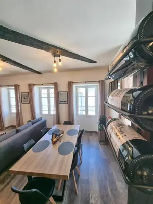 Coin salon dans l'établissement Duplex Le Chai de l'Abreuvoir