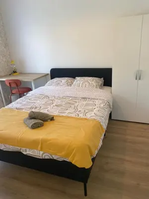 Un ou plusieurs lits dans un hébergement de l'établissement La maison des rêves t4 avec jardin