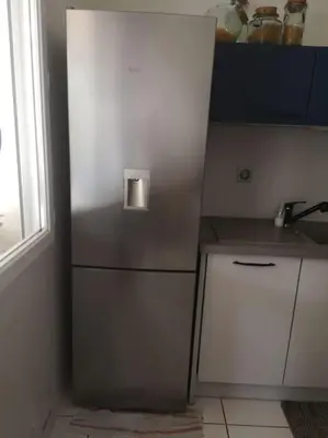 Cuisine ou kitchenette dans l'établissement La Porte Bleue