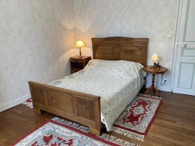 Un ou plusieurs lits dans un hébergement de l'établissement Gite du theil au servant