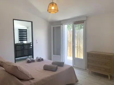 Un ou plusieurs lits dans un hébergement de l'établissement VIDAGO maison neuve tout confort avec terrasse privée