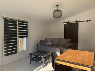 Coin salon dans l'établissement VIDAGO maison neuve tout confort avec terrasse privée