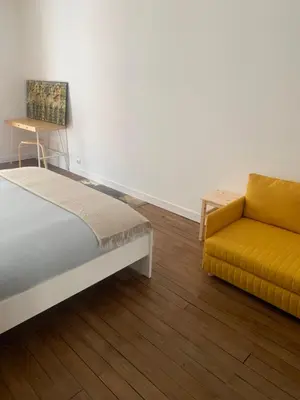 Un ou plusieurs lits dans un hébergement de l'établissement Appart à Mémé 2 chambres