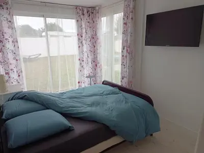 Un ou plusieurs lits dans un hébergement de l'établissement Maison plain pied 2 chambres